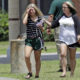 A student, left, reacts after retrieving her belongings inside Santa Fe High School in Santa Fe, Texas.