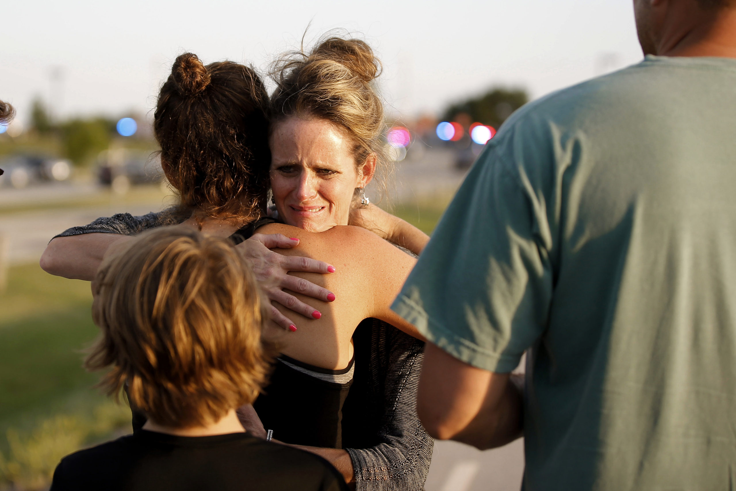 Jennifer Stong hugs Tasha Hunt .