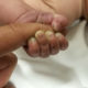Photo of baby who survived being covered by a woodpile for nine hours in Montana.