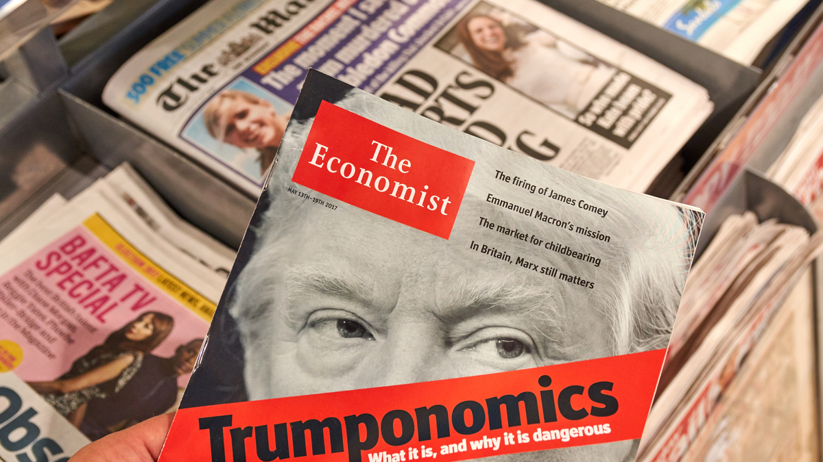 Photo of newstand with a magazine featuring Donald Trump on the cover