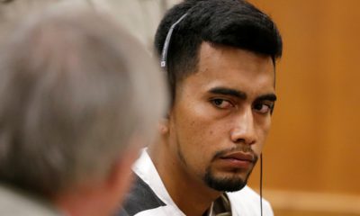 Photo of Cristhian Bahena Rivera speaking with his attorney