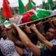 Photo of mourners carrying the dead body of Palestinian teen Nadim Nuwara