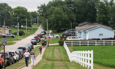 Photo of people walking blocks to attend Mollie Tibbetts' funeral in Brooklyn, Iowa
