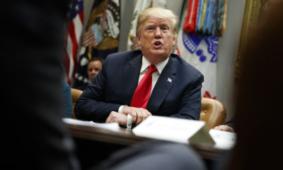Photo of President Trump sitting behind a desk