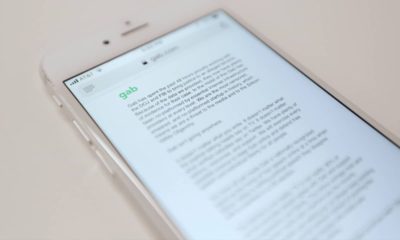 Photo of an iPhone that shows a message from Gab, a social media site