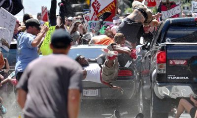 Photo of people flying into the air during a white nationalist rally in Charlottesville, Va.
