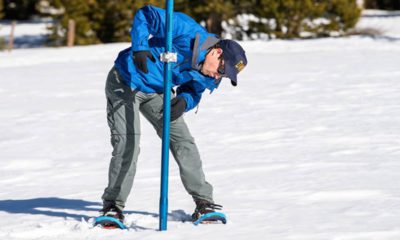 Photo of worker taking snow survey at Phillips Station, California
