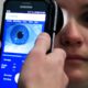 Photo of Clinical Research Assistant Kevin Jackson using AlgometRx Platform Technology on Sarah Taylor's eyes to measure her degree of pain