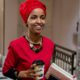 Picture of Rep. Ilhan Omar walking through the halls of the Capitol.