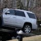 Photo of crime investigators loading a car
