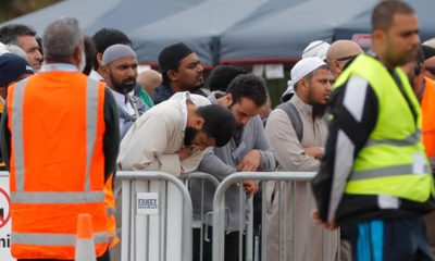 Photo of mourners attending service for a victim of the mosque shootings
