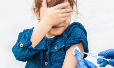 Photo of a young girl getting vaccinated