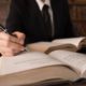 Photo of man writing legislation