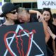 Leslie Gollub, left, and Gretchen Gordon hug at a vigil held to support the victims of the Chabad of Poway synagogue