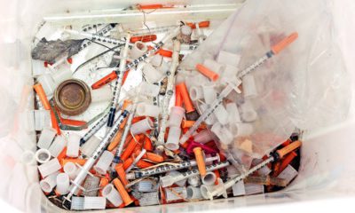 Photo of hypodermic needles, needle caps, and cotton swabs