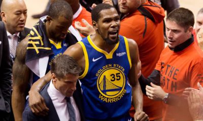 Photo of Kevin Durant reacting as he leaves the court after sustaining injury during Game 5