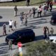 Photo of students holding their hands in the air as they are evacuated in Parkland, Fla.