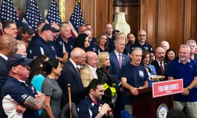 Photo of Jon Stewart speaking at a news conference on behalf of 9/11 victims