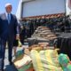 Photo of VP Mike Pence and bales of seized cocaine