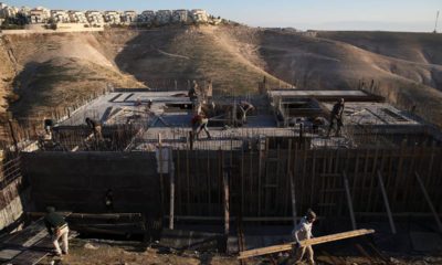 Photo of Palestinian laborers at a construction site