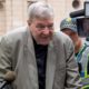 Photo of Cardinal George Pell leaving County Court in Melbourne