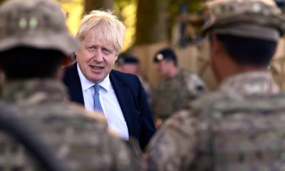 Photo of Boris Johnson talking to Ghurkas