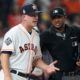 Photo of AJ Hinch arguing a call with an umpire