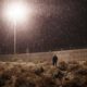 Photo of a U.S. Border Protection officer standing in the rain