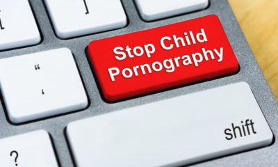 Composite image of a laptop keyboard and the words "Stop Child Pornography"