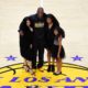 Photo of Los Angeles Lakers' Kobe Bryant poses for pictures with his wife Vanessa, left, and daughters Natalia, second from right, and Gianna