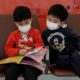 Photo of kids wearing masks to prevent an outbreak of a new virus in China