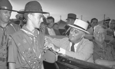 Photo of a boy scout and FDR in 1937