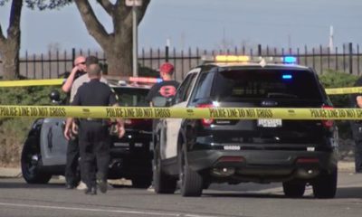 Photo of Fresno police investigating a homicide scene