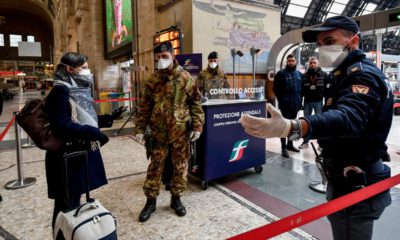 Photo of officers and soldiers checking passengers leaving from Milan main train station, Italy