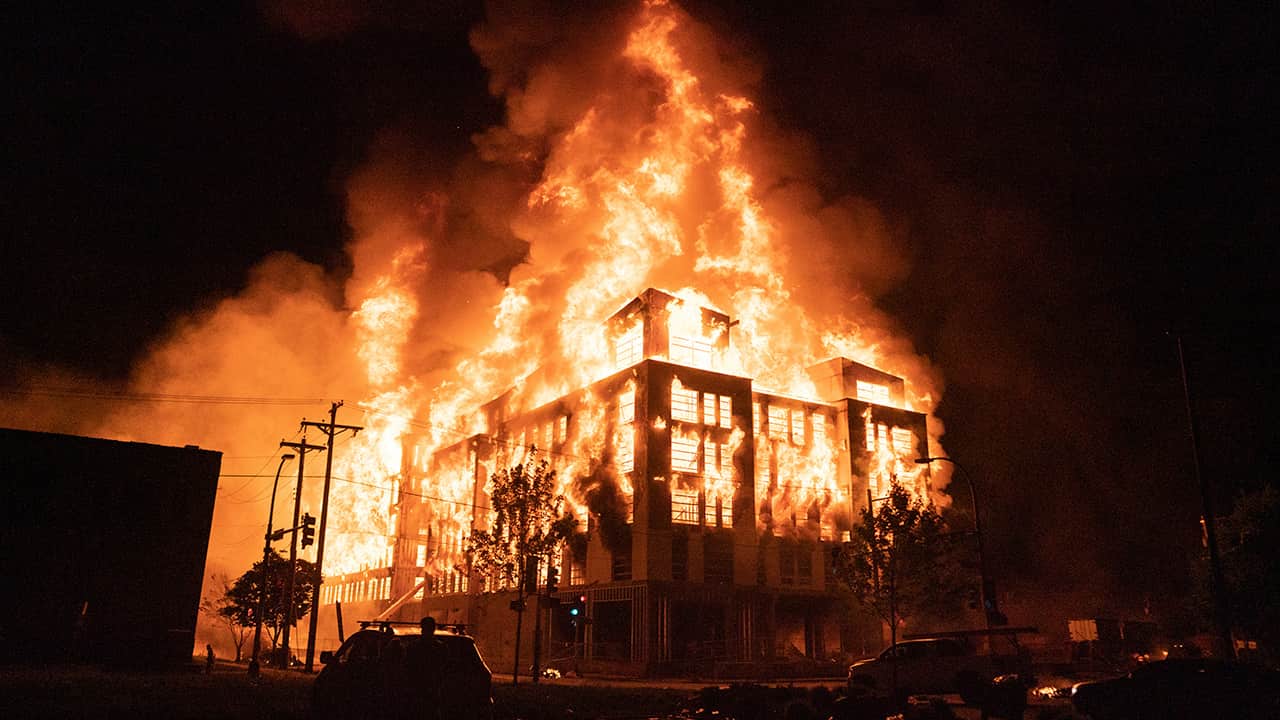 Photo of a housing complex on fire