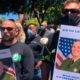 Photo of men holding posters of Sgt. Damon Gutzwiller