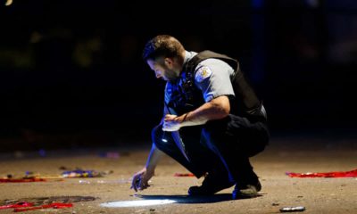 Image of a Chicago police officer at a homicide scene