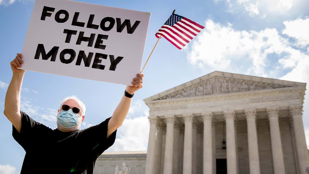 Photo of a man outside the Supreme Court
